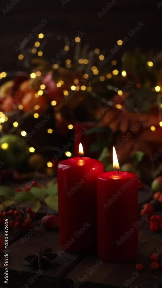 Two red candles among the decorations are blown out by a stream of air and extinguished. Two red candles among the decorations are blown out by a stream of air and extinguished.