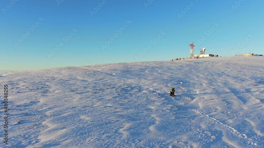 Drone shot of the weather station in winter mountain. Carpathians. Borzhava. With people. Drone shot of the weather station in winter mountain. Carpathians. Borzhava. With people.