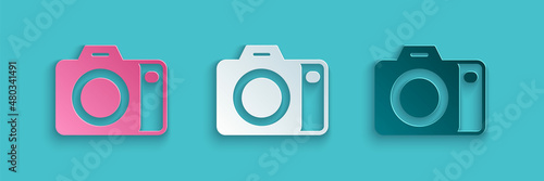 Paper cut Photo camera icon isolated on blue background. Foto camera. Digital photography. Paper art style. Vector