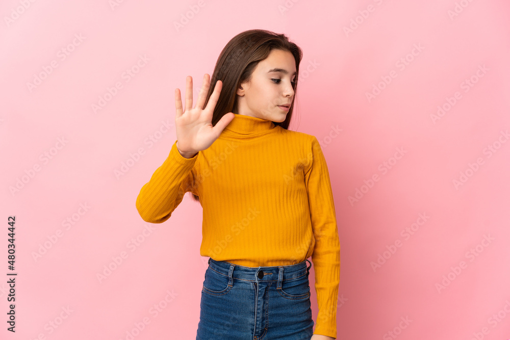 Little girl isolated on pink background making stop gesture and disappointed Little girl isolated on pink background making stop gesture and disappointed