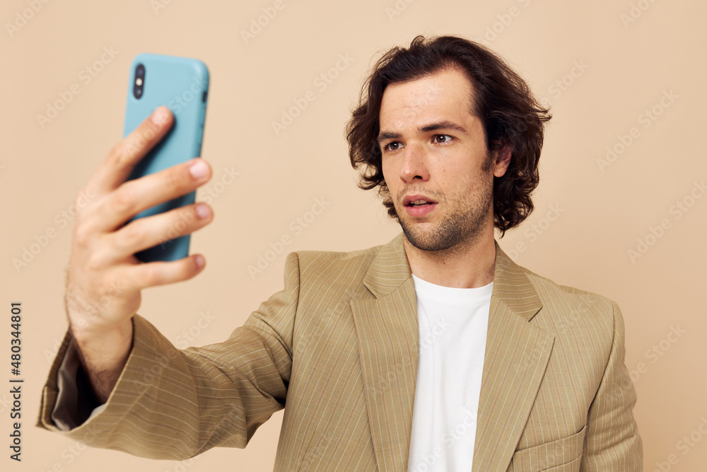 Cheerful man takes a selfie classic style technologies isolated background Cheerful man takes a selfie classic style technologies isolated background