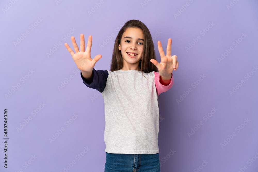 Little girl isolated on purple background counting eight with fingers Little girl isolated on purple background counting eight with fingers