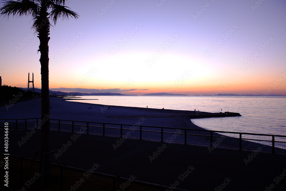 Obraz premium 夕陽と海岸風景