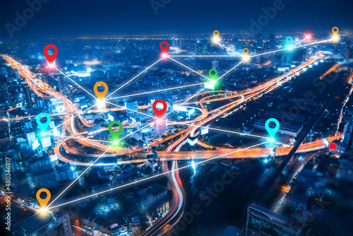 colorful pin landmark location on aerial view of modern downtown skyline and highway transportation in modern city with location link network connection for meter verse trend worldwide link technology photo