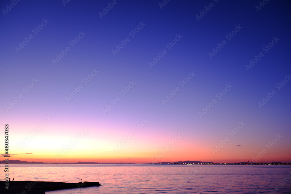 Obraz premium 夕陽と海岸風景