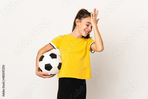 Little football player girl isolated on white background has realized something and intending the solution © luismolinero