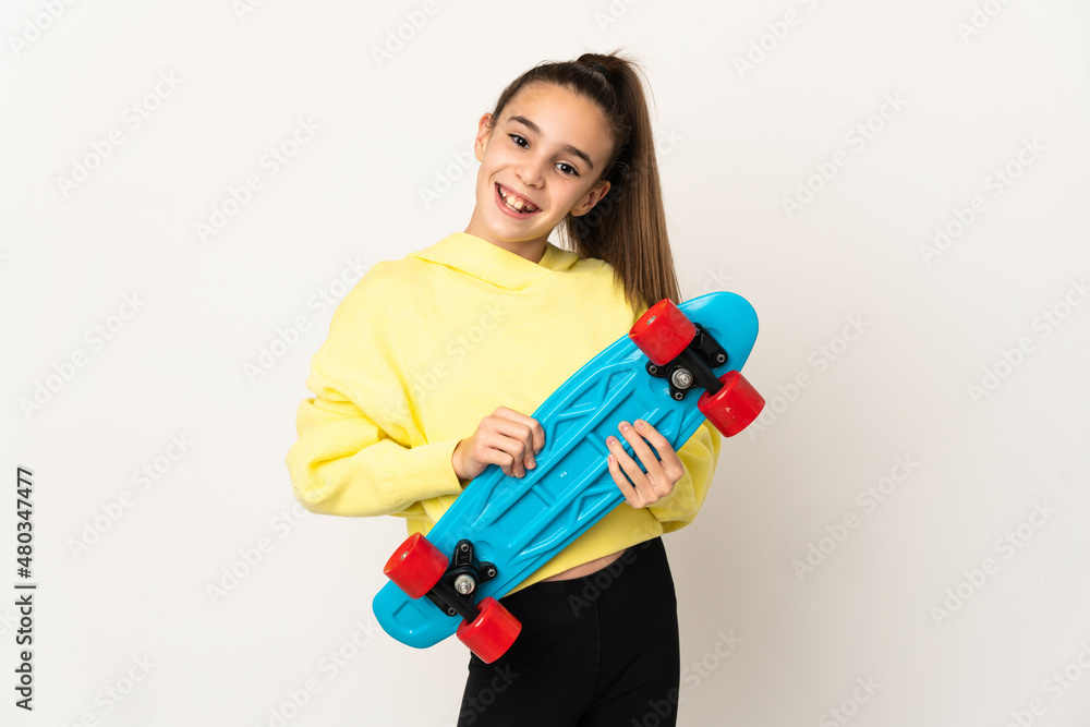 Little girl isolated on white background with a skate with happy expression Little girl isolated on white background with a skate with happy expression