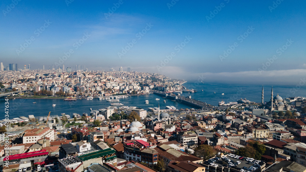 Aerial view of the Bosphorus Strait from the side of Suleymaniye Mosque. Top view of the beautiful cityscape of Istanbul,  parts of Asian Turkey (Anatolia) from European Turkey on sunny day.