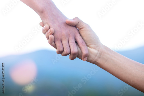 helping hand with mountain background