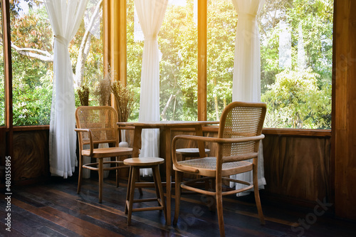 Wooden chairs and wooden table in restroom decoration.