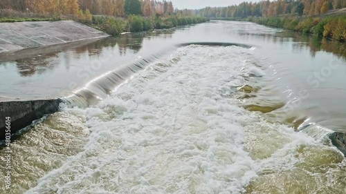 Cooling water output near nuclear power ctation in Smolensk. Slow motion view photo