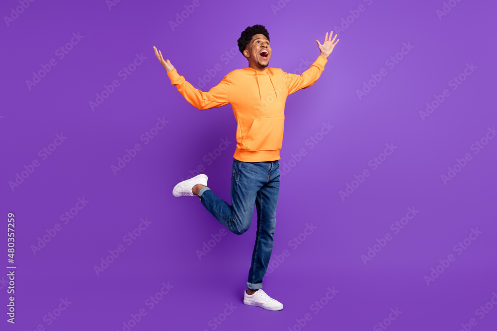 Full size photo of cheerful dark skin amazed man look empty space shocked isolated on purple color background