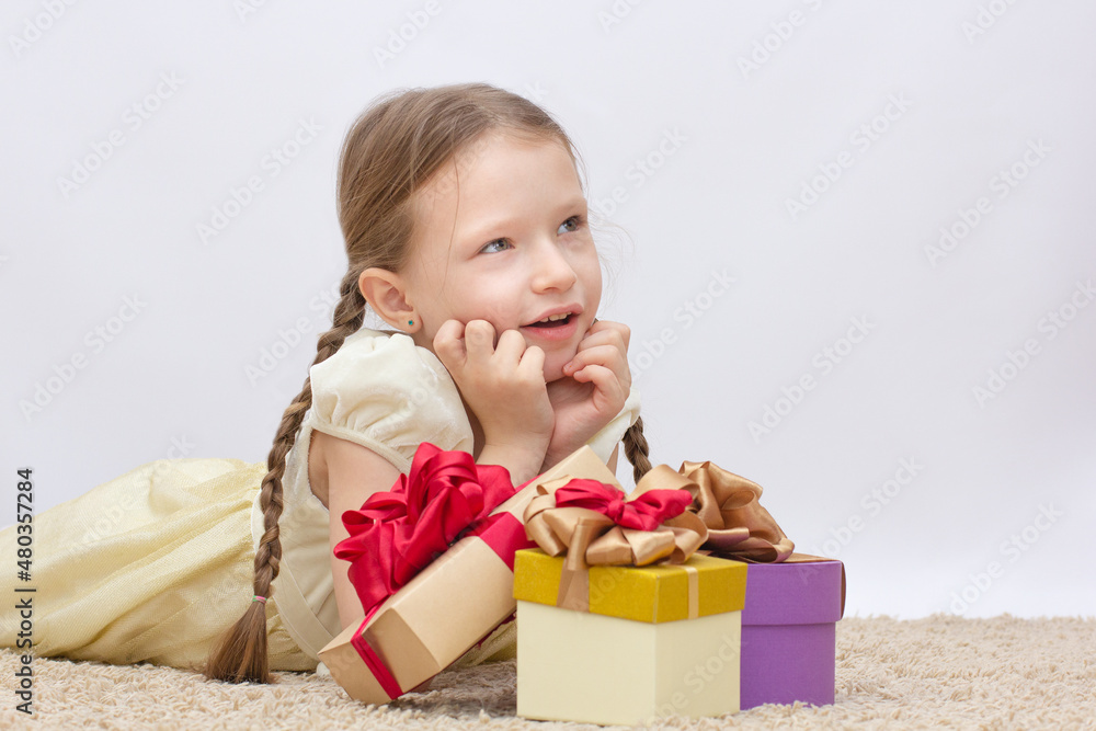 Adorable little surprise girl with purple gift box present on background Adorable little surprise girl with purple gift box present on background
