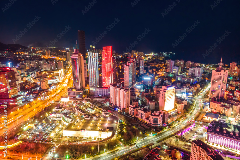Obraz premium Aerial photography night view of modern city buildings in Qingdao, China