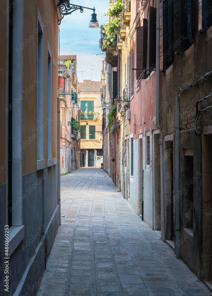 Fototapeta premium Colorful houses in the old medieval street in Venice, Italy