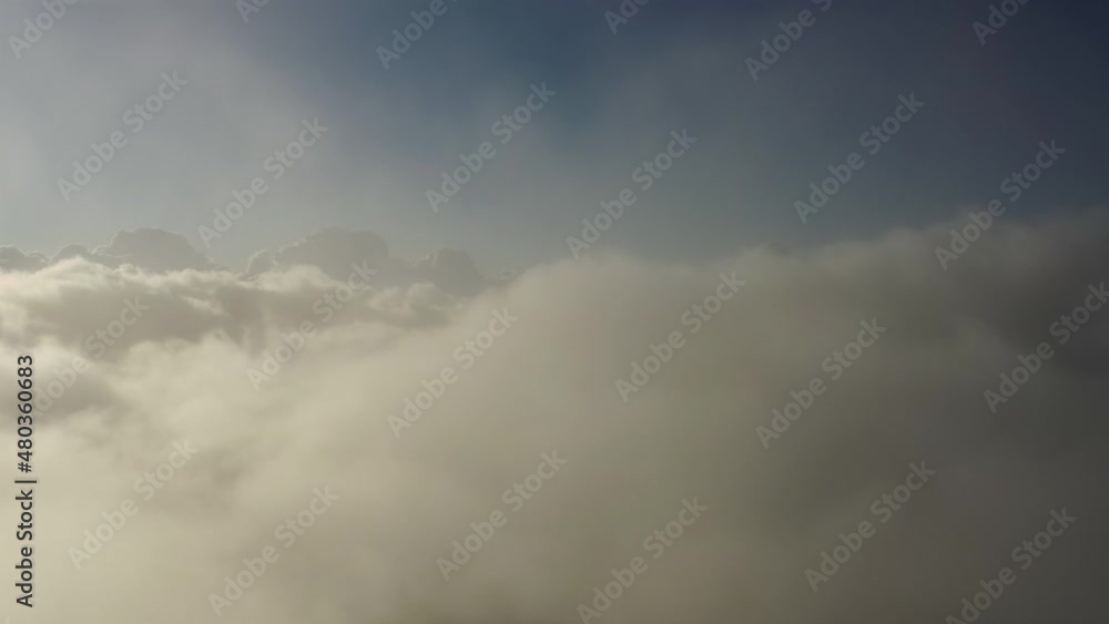 Flying up above the clouds. Aerial view of clouds at sunrise. Traveling by air perfect background, 4k Flying up above the clouds. Aerial view of clouds at sunrise. Traveling by air perfect background, 4k