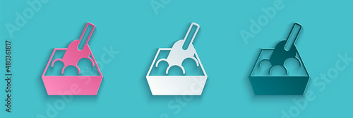Paper cut Cat litter tray with shovel icon isolated on blue background. Sandbox cat with shovel. Paper art style. Vector