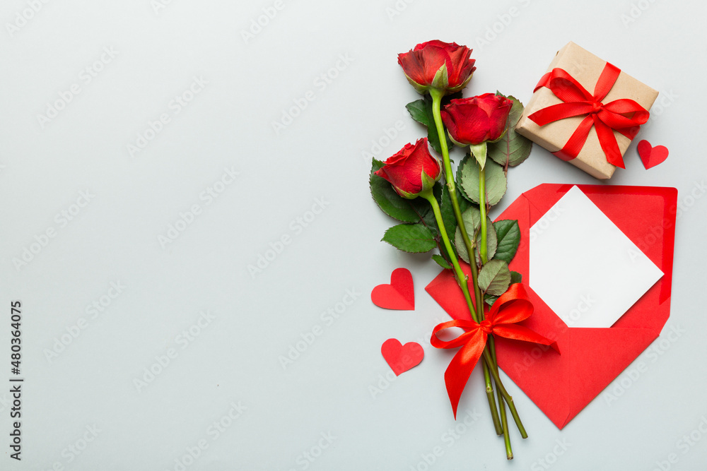 Valentine day composition with Envelope, rose flower and Red heart on table. Top view, flat lay. Holiday concept Valentine day composition with Envelope, rose flower and Red heart on table. Top view, flat lay. Holiday concept