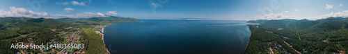 Summertime imagery of Lake Baikal in morning is a rift lake located in southern Siberia, Russia. Baikal lake summer landscape view. Drone's Eye View. Panoramic view. © Quatrox Production