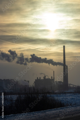 Industrial city at sunset on a winter day 