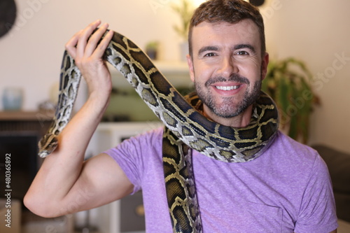 Man with beautiful pet snake 