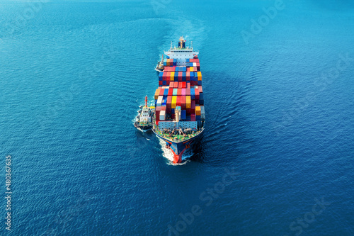 Aerial view of cargo ship with cargo container on sea. © tawatchai1990