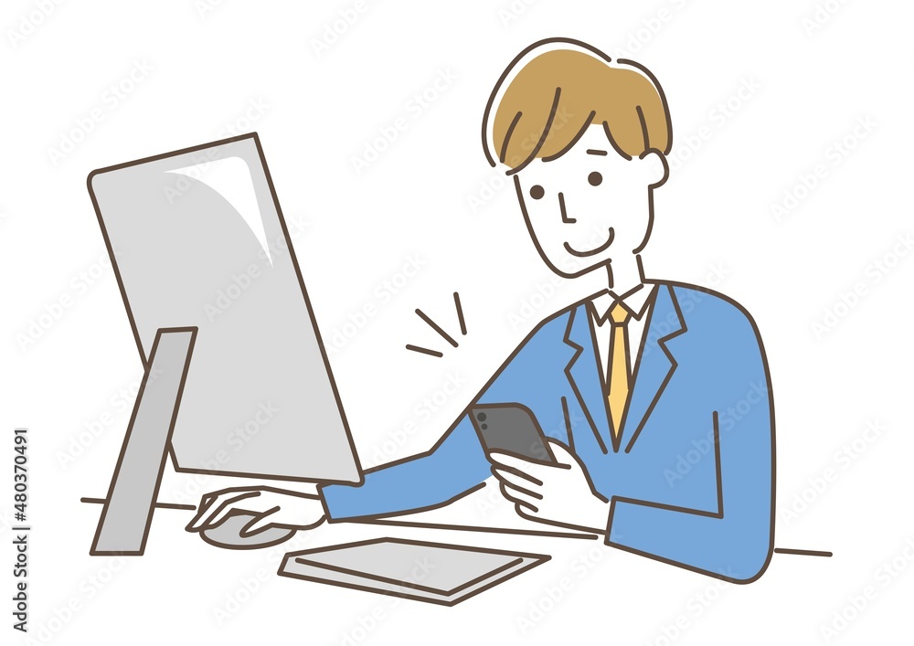 スマホを操作しながら仕事をする男性