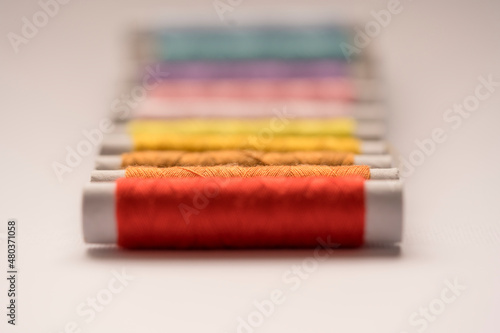 Colored thread, sewing, fabric photo