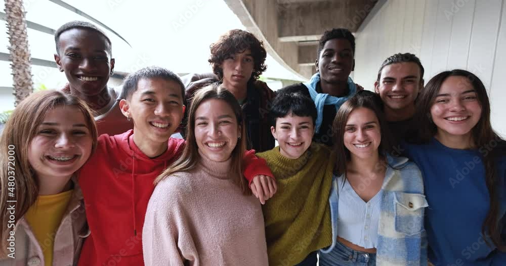 Young multiracial friends having fun together outdoor at university campus Young multiracial friends having fun together outdoor at university campus