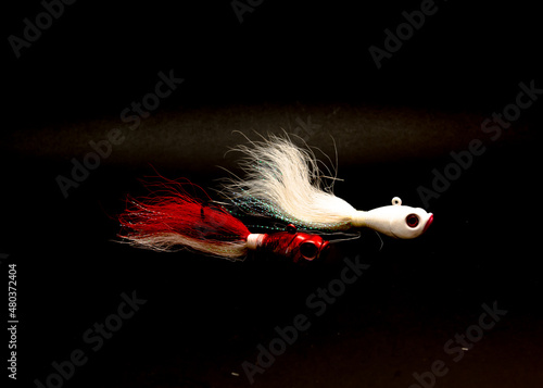 Two bucktail Jig head lure hand tie deer hair fishing jig hooks isolated on black