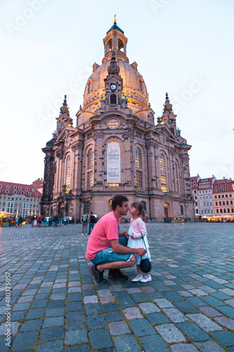 person standing in front of a church
