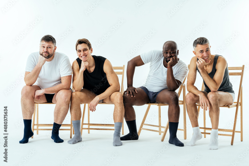 Obraz premium group of multiethnic men posing for a male edition body positive beauty set. Shirtless guys with different age, and body wearing boxers underwear