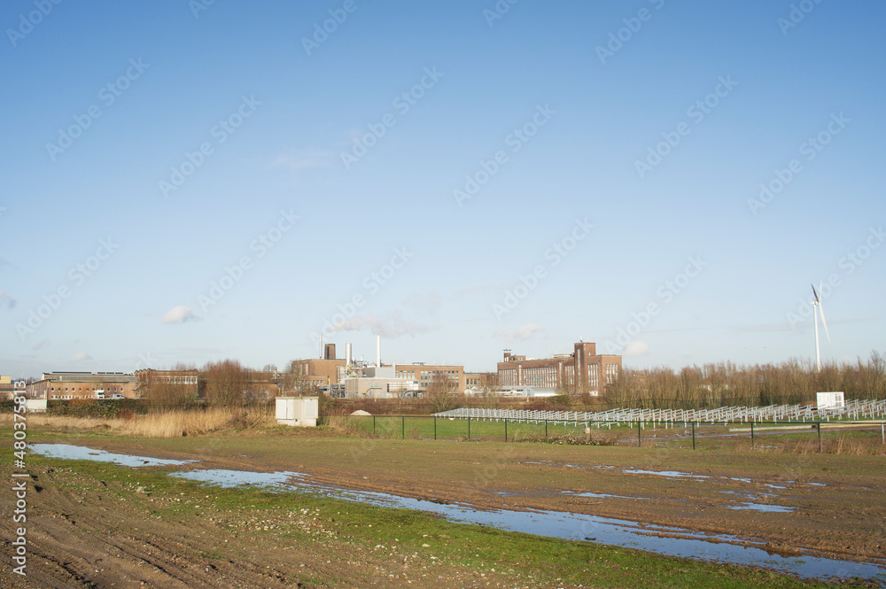 Cityscape of a industrial area with factories and industrial chimneys in Arnhem in the Netherlands