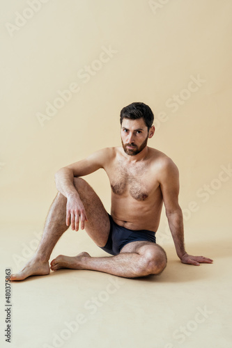 man posing for a male edition body positive beauty set. Shirtless guy wearing boxers underwear in studio © oneinchpunch
