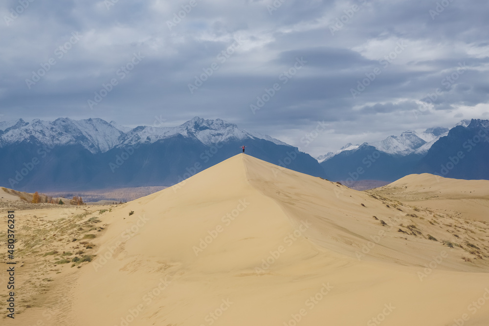 Traveler at the Chara sand dunes