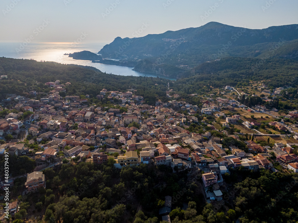 aerial droe view  of Liapades village with beach in background in corfu island greece