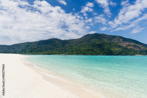 Beautiful sea with white sandy beach and blue sky in tropical island. © bignai