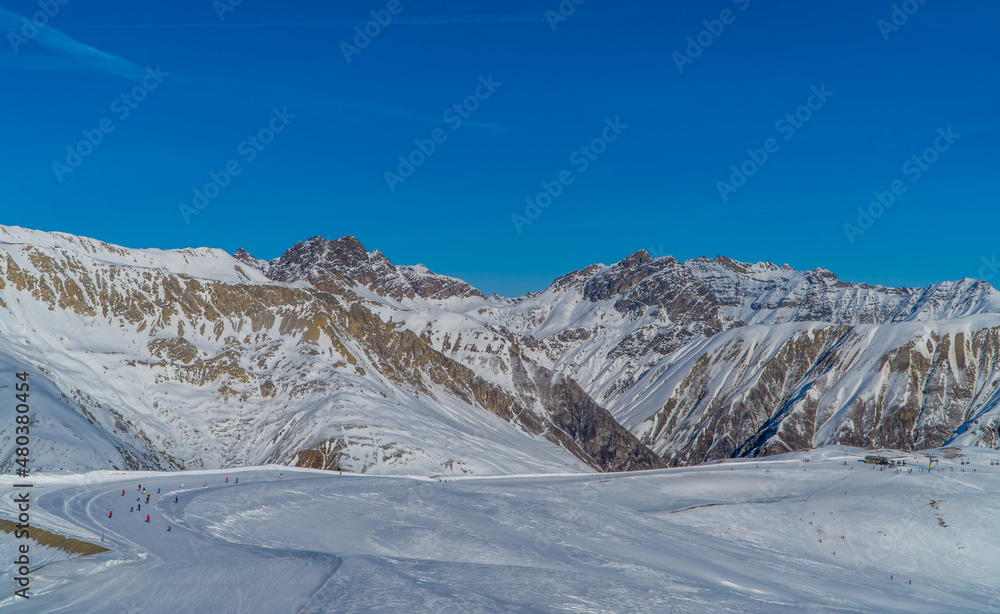 Panorama of skiers on the slopes of the ski resort of Livigno, Italy