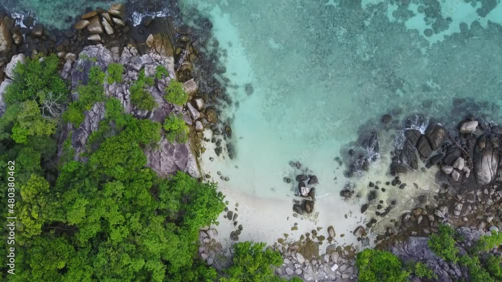 Stunning summer landscape. Aerial view of turquoise Andaman sea with reef and small island at Koh Lipe or Lipe island, Satun, Southern Thailand. 4K drone video Stunning summer landscape. Aerial view of turquoise Andaman sea with reef and small island at Koh Lipe or Lipe island, Satun, Southern Thailand. 4K drone video