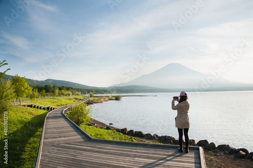 tourist taking photo on the way in park near Fuji mountain, Yamanashi, Japan