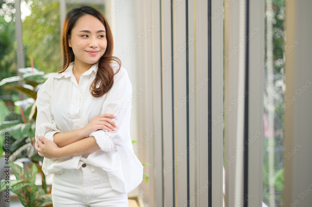 Portrait of confident business asian woman wearing white shirt in office Portrait of confident business asian woman wearing white shirt in office