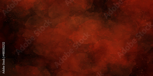 Dark red abstract background or texture red color powder explosion on black background.Freeze motion of red dust particles splashing.