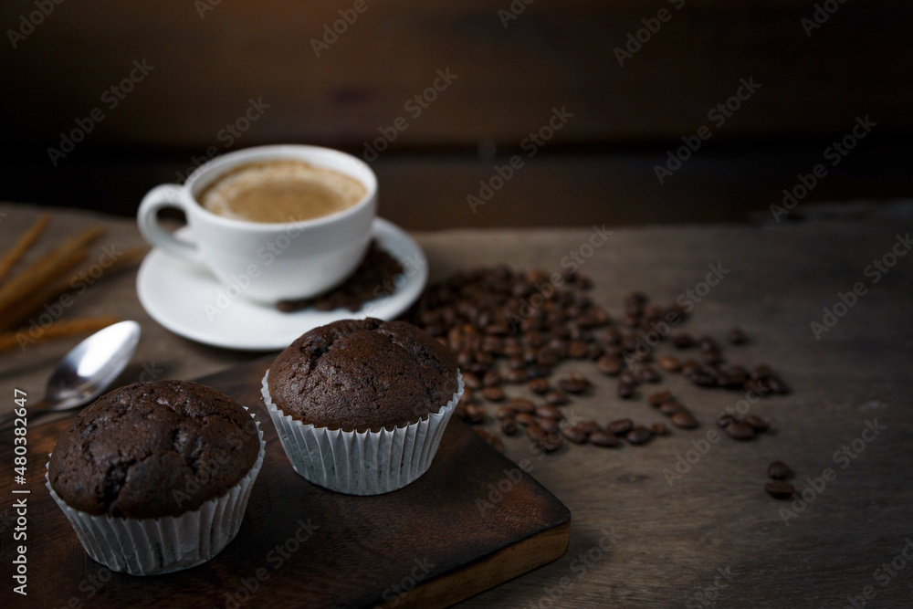 Chocolate cake and a cup of coffee served in the morning. Chocolate cake and a cup of coffee served in the morning.