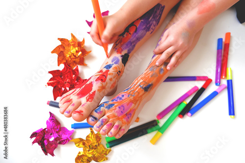 Funny cute bare feet. Child painting coloring feet