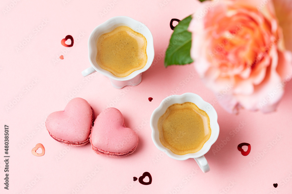 Romantic setup with coffee, macarons and roses Romantic setup with coffee, macarons and roses