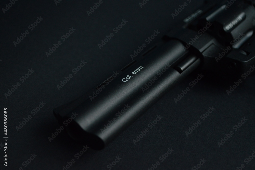 a flobert revolver on the black background a flobert revolver on the black background
