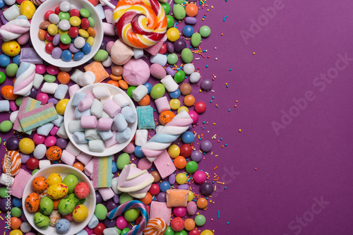 Bright sweet multicolored dragee, candies, lollipops, marshmallows