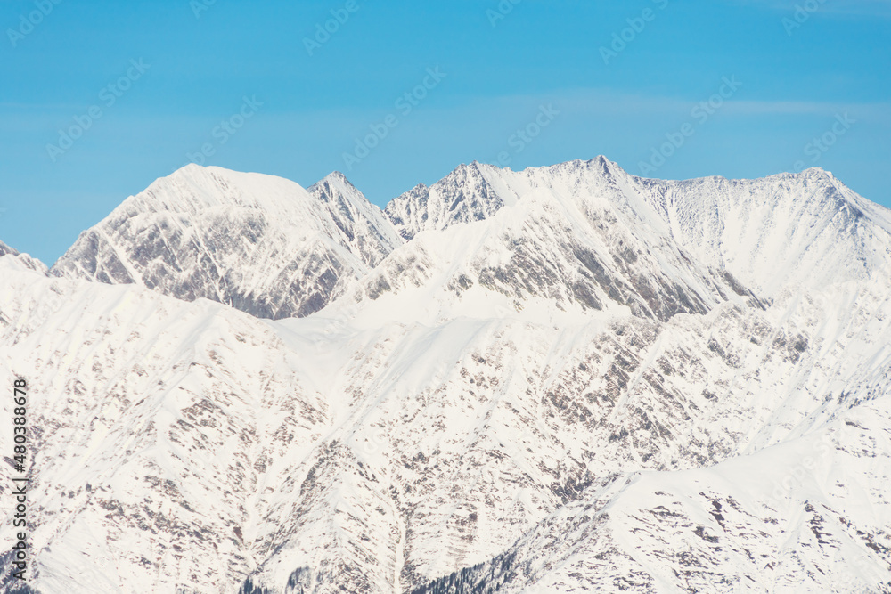 Mountain snowy landscape, mountain range pass blue sky. Mountain snowy landscape, mountain range pass blue sky.