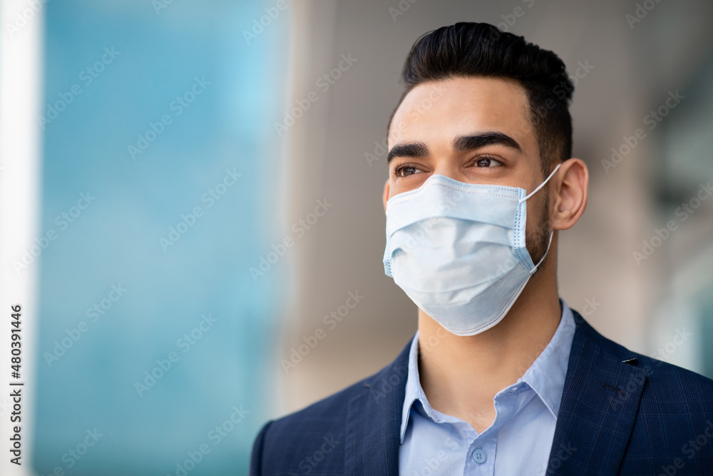 Middle-eastern guy businessman in medical face mask Middle-eastern guy businessman in medical face mask