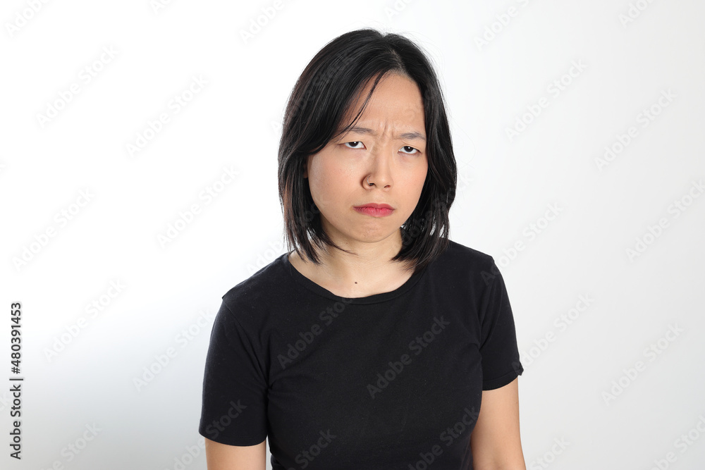 Young attractive south east asian woman pose face expression emotion on white background upset Young attractive south east asian woman pose face expression emotion on white background upset